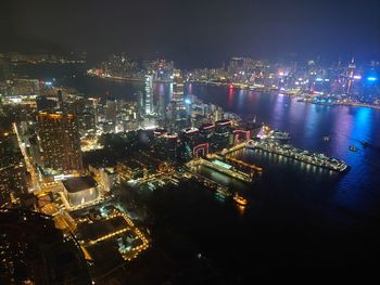 High angle view of illuminated buildings in city at night