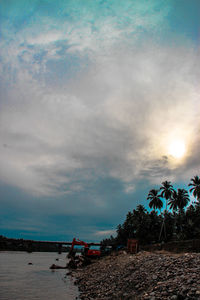 Scenic view of sea against cloudy sky