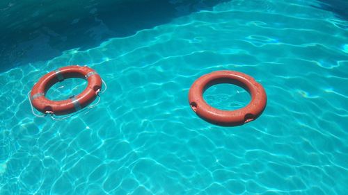 High angle view of ring floating on swimming pool