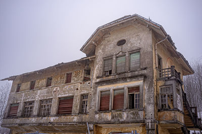 Low angle view of old building against clear sky