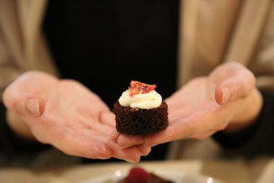 Cropped image of hand holding ice cream