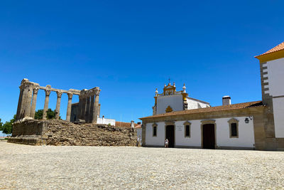 Low angle view of building against blue sky