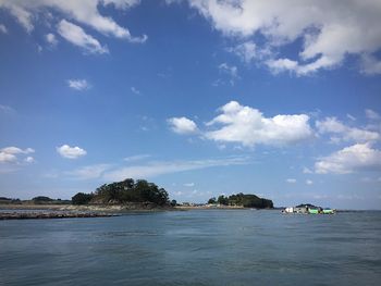 Scenic view of sea against cloudy sky