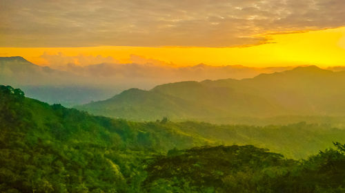 Scenic view of landscape against sky during sunset