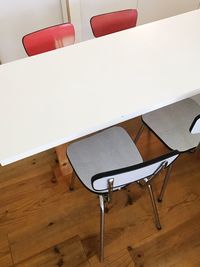 Close-up of empty chairs on table