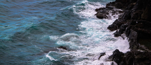 Waves splashing on rocks