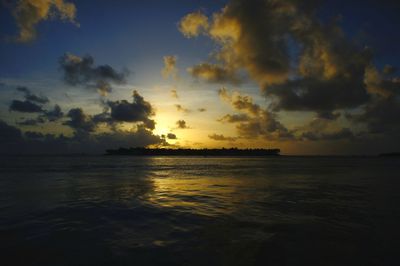 Scenic view of sea against sky at sunset