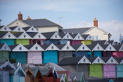 Houses in city against sky