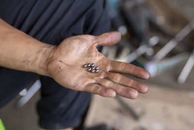 Close-up of man holding hands