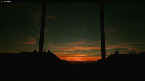 Low angle view of silhouette built structure against sky at sunset