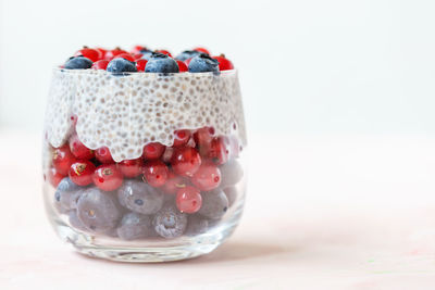 Close-up of candies in glass on table