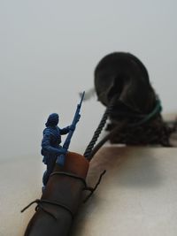 Close-up of hands tied to rope