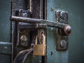 Close-up of padlock on metal door