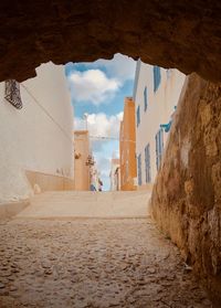 Alley amidst buildings in city