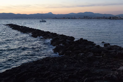 Scenic view of sea against sky during sunset