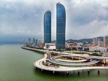 Panoramic view of modern buildings against sky in city