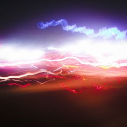 Light trails against sky at night