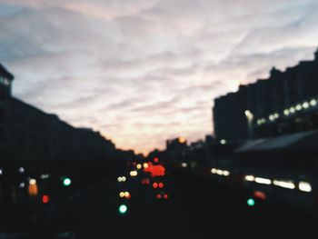 Defocused image of traffic on road at night