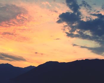 Scenic view of silhouette mountains against sky during sunset