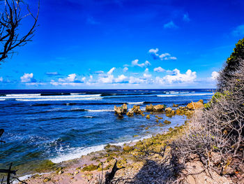 Scenic view of sea against blue sky