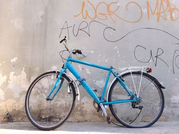 Bicycle against graffiti wall