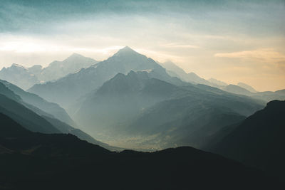 Scenic view of mountains against sky during sunset