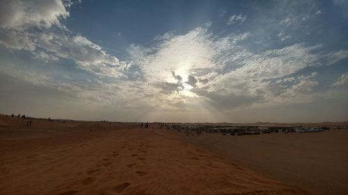 Scenic view of desert against sky during sunset