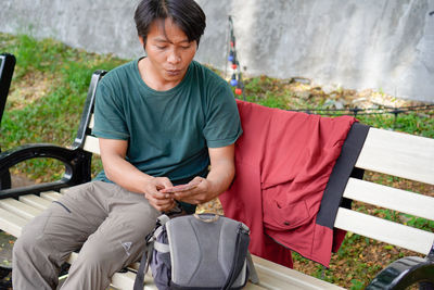 Portrait of young man sitting on chair