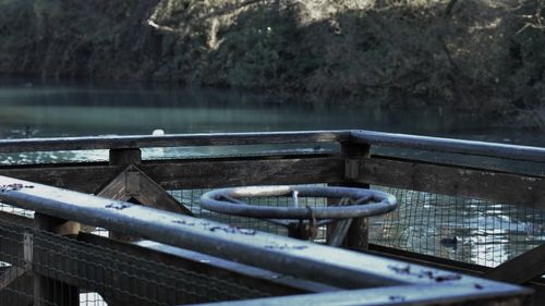 Boat moored by lake