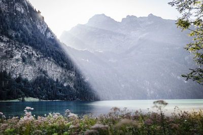 Scenic view of lake with mountains in background