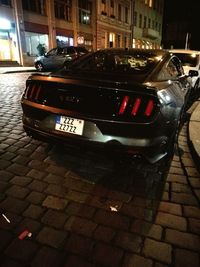 Cars on street in city at night