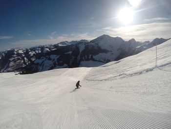 Side view of skiing on snow landscape