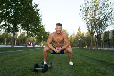 Low section of man exercising in park