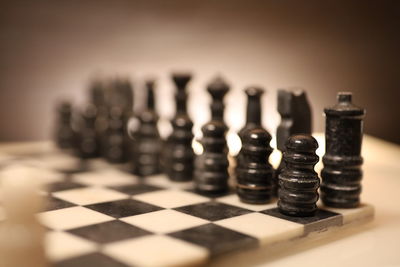 Close-up of chess pieces on table