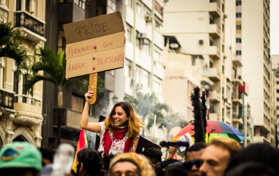 Woman with text on street in city