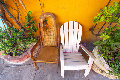 High angle view of empty chairs and tables in yard