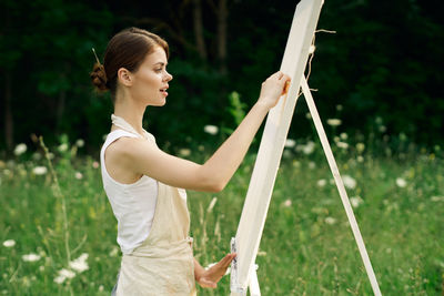 Woman standing on field