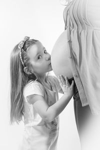 Side view of girl looking at camera