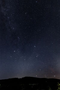 Low angle view of stars in sky at night