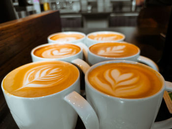 Close-up of cappuccino served on table