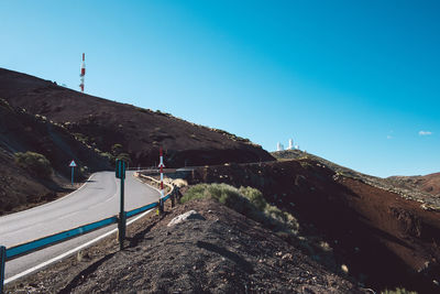 Scenic view of mountains against clear blue sky