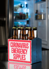 Close-up of wine bottles on shelf at home