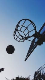 Low angle view of basketball hoop against blue sky