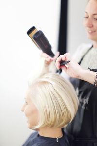 Woman having haircut, stockholm, sweden