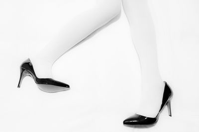 Close-up of shoes over white background