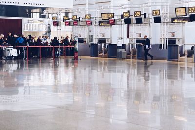 Group of people walking on airport