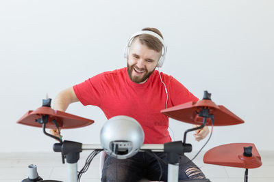 Young man sitting on bicycle