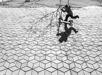Woman standing by railing