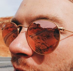 Close-up portrait of man wearing sunglasses