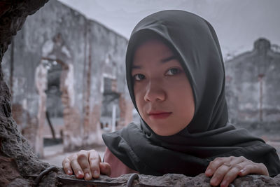 Portrait of young woman looking at camera